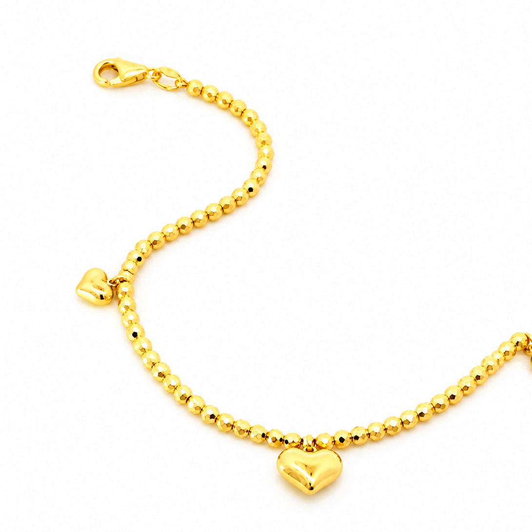916 Gold Triple Heart Charm Bracelet in S style with clasp at 11 o'clock